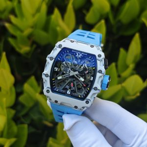 The Richard Mille RM35-03, in white, is equipped with a customized Parmigiani movement. All functions are authentic and operational. It features a deployable butterfly rotor, a customized imported carbon fiber case, and a blue natural rubber strap. - Image 4