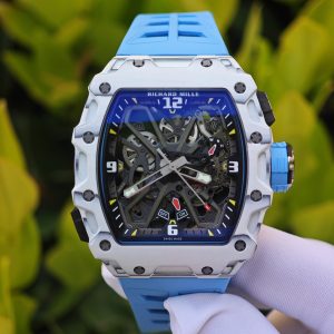 The Richard Mille RM35-03, in white, is equipped with a customized Parmigiani movement. All functions are authentic and operational. It features a deployable butterfly rotor, a customized imported carbon fiber case, and a blue natural rubber strap. - Image 5
