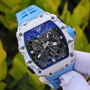 The Richard Mille RM35-03, in white, is equipped with a customized Parmigiani movement. All functions are authentic and operational. It features a deployable butterfly rotor, a customized imported carbon fiber case, and a blue natural rubber strap. - Image 6