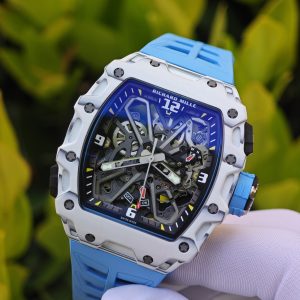 The Richard Mille RM35-03, in white, is equipped with a customized Parmigiani movement. All functions are authentic and operational. It features a deployable butterfly rotor, a customized imported carbon fiber case, and a blue natural rubber strap. - Image 7