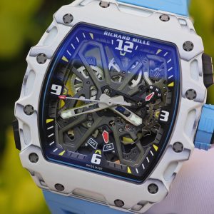 The Richard Mille RM35-03, in white, is equipped with a customized Parmigiani movement. All functions are authentic and operational. It features a deployable butterfly rotor, a customized imported carbon fiber case, and a blue natural rubber strap. - Image 10