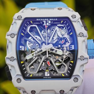 The Richard Mille RM35-03, in white, is equipped with a customized Parmigiani movement. All functions are authentic and operational. It features a deployable butterfly rotor, a customized imported carbon fiber case, and a blue natural rubber strap. - Image 11