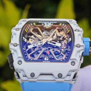 The Richard Mille RM35-03, in white, is equipped with a customized Parmigiani movement. All functions are authentic and operational. It features a deployable butterfly rotor, a customized imported carbon fiber case, and a blue natural rubber strap. - Image 12