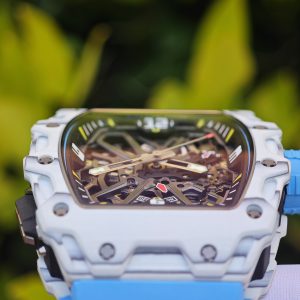 The Richard Mille RM35-03, in white, is equipped with a customized Parmigiani movement. All functions are authentic and operational. It features a deployable butterfly rotor, a customized imported carbon fiber case, and a blue natural rubber strap. - Image 13