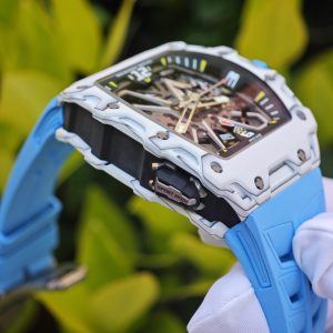 The Richard Mille RM35-03, in white, is equipped with a customized Parmigiani movement. All functions are authentic and operational. It features a deployable butterfly rotor, a customized imported carbon fiber case, and a blue natural rubber strap. - Image 14