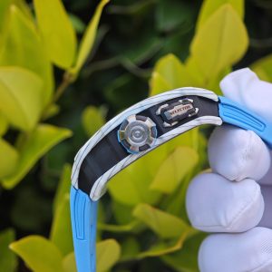 The Richard Mille RM35-03, in white, is equipped with a customized Parmigiani movement. All functions are authentic and operational. It features a deployable butterfly rotor, a customized imported carbon fiber case, and a blue natural rubber strap. - Image 17