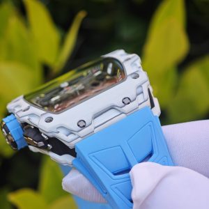The Richard Mille RM35-03, in white, is equipped with a customized Parmigiani movement. All functions are authentic and operational. It features a deployable butterfly rotor, a customized imported carbon fiber case, and a blue natural rubber strap. - Image 18