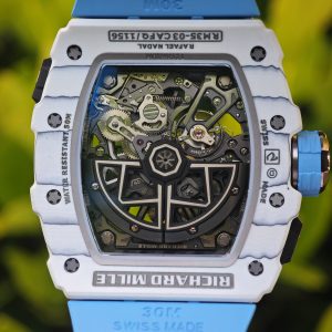 The Richard Mille RM35-03, in white, is equipped with a customized Parmigiani movement. All functions are authentic and operational. It features a deployable butterfly rotor, a customized imported carbon fiber case, and a blue natural rubber strap. - Image 25