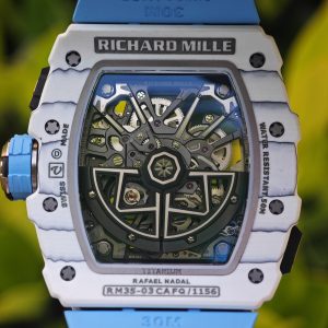 The Richard Mille RM35-03, in white, is equipped with a customized Parmigiani movement. All functions are authentic and operational. It features a deployable butterfly rotor, a customized imported carbon fiber case, and a blue natural rubber strap. - Image 26