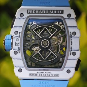 The Richard Mille RM35-03, in white, is equipped with a customized Parmigiani movement. All functions are authentic and operational. It features a deployable butterfly rotor, a customized imported carbon fiber case, and a blue natural rubber strap. - Image 27