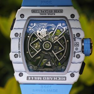 The Richard Mille RM35-03, in white, is equipped with a customized Parmigiani movement. All functions are authentic and operational. It features a deployable butterfly rotor, a customized imported carbon fiber case, and a blue natural rubber strap. - Image 28