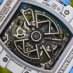 The Richard Mille RM35-03, in white, is equipped with a customized Parmigiani movement. All functions are authentic and operational. It features a deployable butterfly rotor, a customized imported carbon fiber case, and a blue natural rubber strap. - Image 29