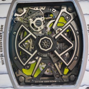 The Richard Mille RM35-03, in white, is equipped with a customized Parmigiani movement. All functions are authentic and operational. It features a deployable butterfly rotor, a customized imported carbon fiber case, and a blue natural rubber strap. - Image 30